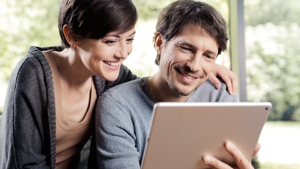 couple uses tablet