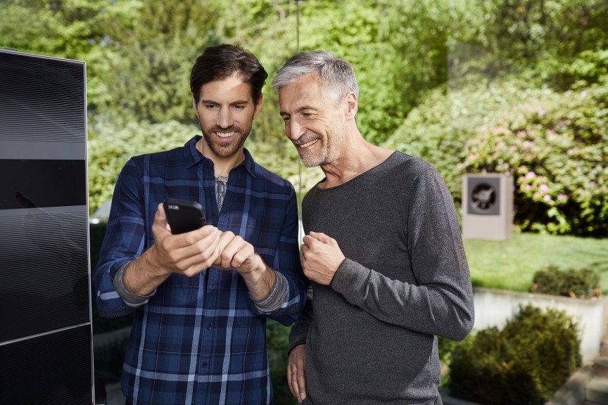 installer and man look at phone